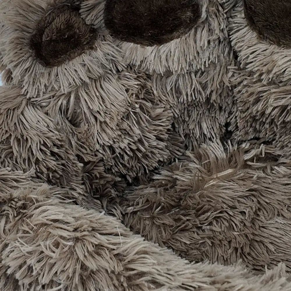 Close-up of a fluffy, Bear Paw Shape Plush Pet Nest Sofa Bed with textured fur.