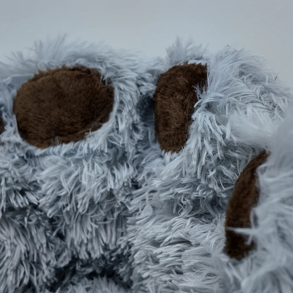 Close-up of a Bear Paw Shape Plush Pet Nest Sofa Bed with white fur on a white background