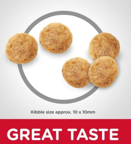 Dog food kibble on a white background with 'GREAT TASTE' text