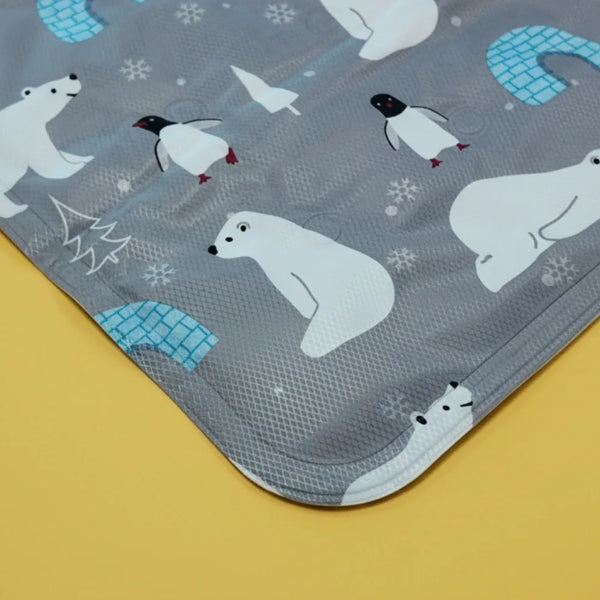 Pet Cooling Mat with polar bear and penguin pattern on a yellow background