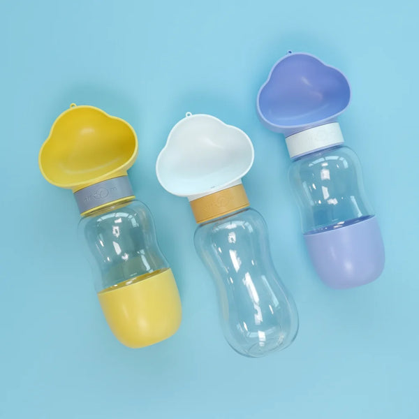 Three transparent Portable Cloud-shape Dog Water Bottle with Walking Cup with colorful lids on a light blue background